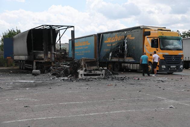 RUSSIA, LUGANSK - JULY 14, 2026: Destroyed vehicles are seen after a military strike on a parking lot with civilian trucks. Alexander Reka TASS  95028678