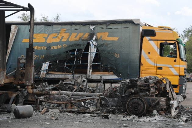 RUSSIA, LUGANSK - JULY 14, 2026: A destroyed vehicle is seen after a military strike on a parking lot with civilian trucks. Alexander Reka TASS  95028637