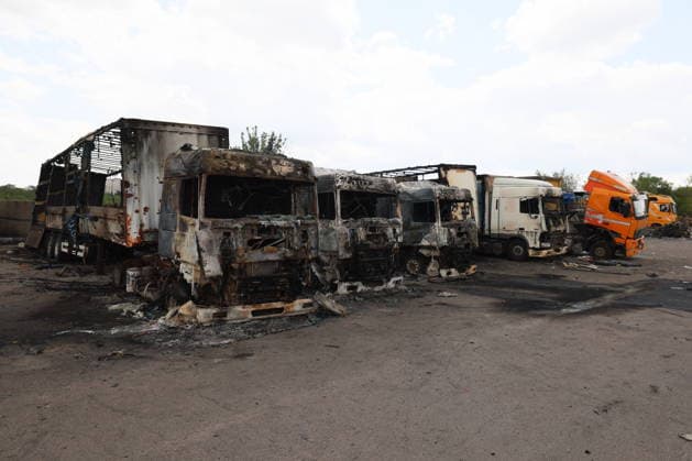 RUSSIA, LUGANSK - JULY 14, 2026: Destroyed vehicles are seen after a military strike on a parking lot with civilian trucks Lugansk Russia  - ZUMAt113 20260714_zaa_t113_238 Copyright: xAlexanderxRekax