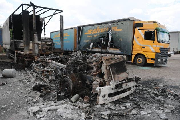 RUSSIA, LUGANSK - JULY 14, 2026: Destroyed vehicles are seen after a military strike on a parking lot with civilian trucks Lugansk Russia  - ZUMAt113 20260714_zaa_t113_244 Copyright: xAlexanderxRekax