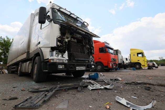 RUSSIA, LUGANSK - JULY 14, 2026: Destroyed vehicles are seen after a military strike on a parking lot with civilian trucks Lugansk Russia  - ZUMAt113 20260714_zaa_t113_248 Copyright: xAlexanderxRekax