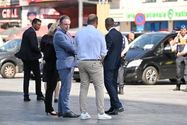 Prime Minister Bart De Wever, Bruxelles-Brussel mayor Philippe Close and pictured at the scene of a fire at the OXY building at place De Brouckere, in Brussels, Tuesday 14 July 2026s. The Brussels Labour Inspectorate confirms several bodies were found in the lift shafts, 6 people are still missing. The fire broke out on the second floor of the building that is currently being renovated.  EMILExWINDAL 181129891