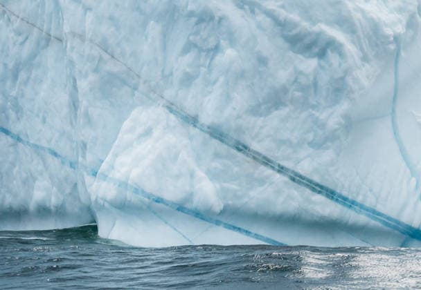 Creative Highlights World Close up of massive iceberg wall with blue stripes at sea Twillingate, Newfoundland and Labrador, Canada CR_DOHO260712F-2072576-01 ,model released, Symbolfoto ,property released