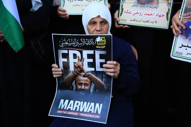 July 14, 2026, Nablus, Palestine: An elderly Palestinian woman holds up a poster of leader Marwan Barghouti, during a demonstration in downtown Nablus in the West Bank, demanding his release from Israeli prison. Released prisoners said that prison guards fired rubber bullets at the Palestinian leader Marwan Barghouti inside his cell. Barghouti is serving five life sentences plus forty years, and has spent more than twenty-four years in Israeli prison. Nablus Palestine  - ZUMAs197 20260714_aaa_s197_099 Copyright: xNasserxishatyehx