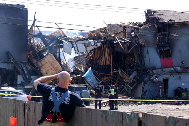 July 14, 2026, Edmonton, On, Canada: Edmonton police and fire investigators attend the scene of a structure fire at 132 Avenue and 82 Street in Edmonton, on Tuesday, July 14, 2026. Edmonton Canada  - ZUMAc35_ 20260714_zaf_c35_095 Copyright: xJamesxMaclennanx