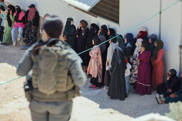 Hebron West Bank Home Demolition Palestinian women gather near an Israeli security force during a home demolition operation in Al-Deirat, south of Hebron, occupied West Bank on July 14, 2026. Israeli forces demolish the home of Osama Masaaf on the grounds that it lacked an Israeli-issued building permit, displacing a Palestinian family of eight. Hebron West Bank Palestinian Territories Copyright: xMosabxShawerx