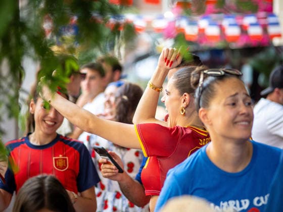 July 14, 2026, New York, New York, USA: Two Spain supporters among a crowd of French fans erupts in celebration as Spain scores, at a Soho bar in New York City where fans have gathered to watch the FIFA semifinal between France and Spain. New York USA - ZUMAc266 20260714_znp_c266_014 Copyright: xCarlosxChiossonex