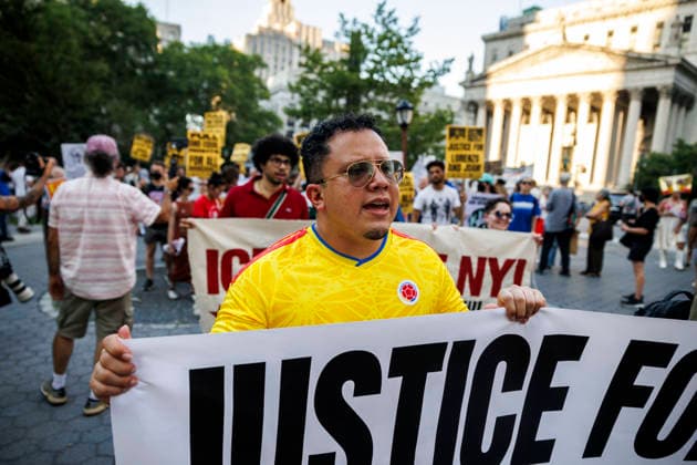 July 14, 2026, New York, New York, USA: A person is seen amongst rally-goers. Protesters gather and demand justice for Lorenzo Salgado Araujo, 52, a man shot and killed by Immigration and Customs Enforcement (ICE). Protesters call for a full investigation into the fatal shooting and demand an end to local collaboration with ICE. New York USA - ZUMAh182 20260714_znp_h182_001 Copyright: xMatthewxHoenx