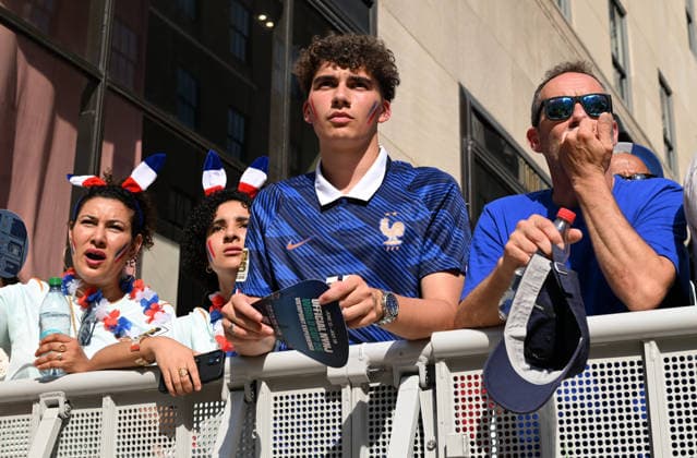 July 14, 2026, New York, New York, USA: July 14, 2026 - New York, NY, USA - New Yorkers and tourists supporting Spain and France in the semi-final match of the World Cup gather in Rockefeller Center for a watch party. Despite the high heat and sun the area was packed. The promising run to the final for France and Mbappe ends with SpainÃ¢â‚¬â ¢s win 2-0. The fans were on the pitch and in the Channel Gardens. (Andrea RENAULT Zuma Press) New York USA - ZUMAg115 20260714_faf_g115_009 Copyright: xAndreaxRenaultx