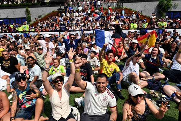 July 14, 2026, New York, New York, USA: July 14, 2026 - New York, NY, USA - New Yorkers and tourists supporting Spain and France in the semi-final match of the World Cup gather in Rockefeller Center for a watch party. Despite the high heat and sun the area was packed. The promising run to the final for France and Mbappe ends with SpainÃ¢â‚¬â ¢s win 2-0. The fans were on the pitch and in the Channel Gardens. (Andrea RENAULT Zuma Press) New York USA  - ZUMAg115 20260714_faf_g115_035 Copyright: xAndreaxRenaultx