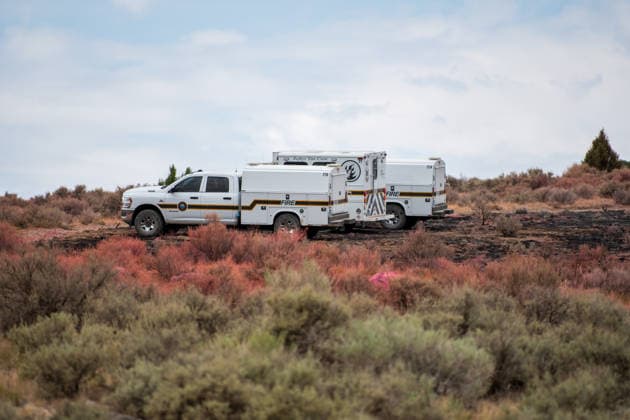 July 14, 2026, Vernon, Utah, USA: Firefighting vehicles sit parked on charred ground along a fire containment line near Vernon, Utah, on Tuesday, July 14, 2026. Crews continue to secure perimeters and monitor burn scars left by the active Stookey wildfire in Tooele County. Vernon USA - ZUMAm292 20260714_znp_m292_034 Copyright: xCharlesxMcClintockxWilsonx