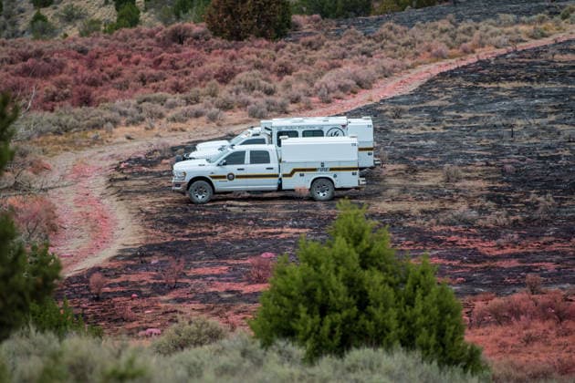 July 14, 2026, Vernon, Utah, USA: Firefighting vehicles sit parked on charred ground along a fire containment line near Vernon, Utah, on Tuesday, July 14, 2026. Crews continue to secure perimeters and monitor burn scars left by the active Stookey wildfire in Tooele County. Vernon USA - ZUMAm292 20260714_znp_m292_035 Copyright: xCharlesxMcClintockxWilsonx
