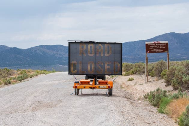 July 14, 2026, Vernon, Utah, USA: A portable electronic message board warns drivers of a road closure near Vernon, Utah, on Tuesday, July 14, 2026. Local authorities closed several surrounding routes to clear paths for emergency response personnel battling the active Stookey wildfire in Tooele County. Vernon USA - ZUMAm292 20260714_znp_m292_040 Copyright: xCharlesxMcClintockxWilsonx
