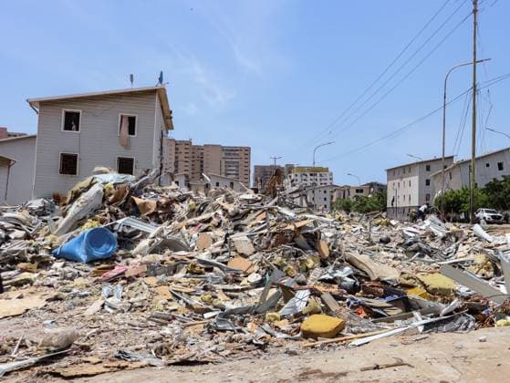 July 14, 2026, La Guaira, Venezuela (Bolivarian Republic of: PLAYA GRANDE, LA GUAIRA, VENEZUELA Ã¢â‚¬ JULY 14, 2026: Excavators and civil carry out controlled demolition and debris removal operations in the coastal community of Playa Grande, one of the areas hardest hit by the earthquake that struck northern Venezuela 20 days earlier. The operations have entered the recovery phase, focusing on clearing major roads blocked by collapsed residential buildings to restore access and mobility for residents as reconstruction efforts continue. JNA Press. La Guaira Venezuela (Bolivarian Republic of - ZUMAq101 20260714_zna_q101_182 Copyright: xMarioxFloresx