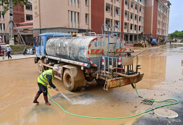 (260715) -- GUIGANG, July 15, 2026 -- People clear mud after flooding at a high school in Guigang, south China s Guangxi Zhuang Autonomous Region, July 15, 2026. Flood relief and recovery efforts were underway after the city was hit by severe rainstorms and flooding caused by Typhoon Maysak. ) CHINA-GUANGXI-GUIGANG-FLOOD-AFTERMATH (CN) LuxBoan 