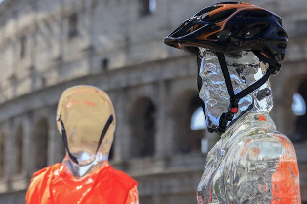 Greenpeace action on impact of global warming on workers in Italy ROME, ITALY, JULY 15: Ice statues representing a farm worker, a construction worker and a food delivery rider stand in front of the Colosseum after being placed by Greenpeace activists to melt under the sun during an awareness campaign highlighting the impact of global warming on workers, as a new heatwave grips in Rome, Italy on July 15, 2026. Seven cities were placed under a red alert on Wednesday, with the number expected to rise on Thursday, July 16, and temperatures forecast to exceed 40 degrees Celsius in many areas. Riccardo De Luca Anadolu Rome Italy. Editorial use only. Please get in touch for any other usage.  Copyright: x2026xAnadoluxRiccardoxDexLucax