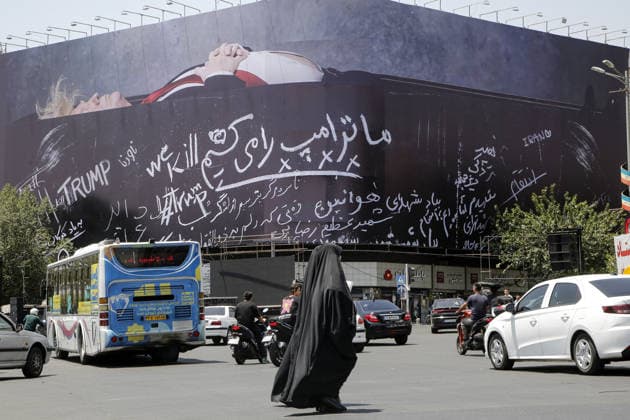 Giant billboard depicting Donald Trump hung in Tehran s Revolution Square TEHRAN, IRAN - JULY 15 : A view of a billboard depicting US President Donald Trump lying in a black coffin made of concrete barriers is hung at Enghelab (Revolution) Square with slogans written on the coffin walls , referring to the chalk-written barriers used at the ceremony for the late Iranian leader Ali Khamenei at the Imam Khomeini Musalla Mosque, on July 15, 2026 in Tehran, Iran. Fatemeh Bahrami Anadolu Tehran Iran. Editorial use only. Please get in touch for any other usage.  Copyright: x2026xAnadoluxFatemehxBahramix