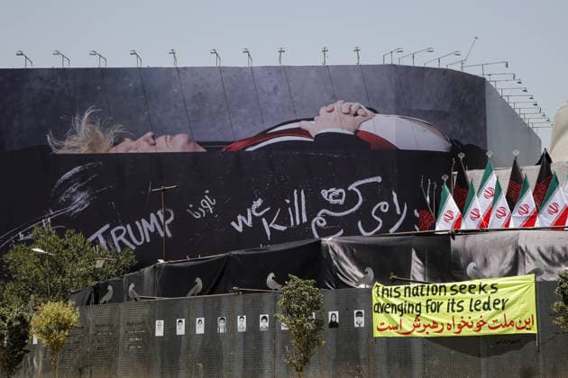 Giant billboard depicting Donald Trump hung in Tehran s Revolution Square TEHRAN, IRAN - JULY 15 : A view of a billboard depicting US President Donald Trump lying in a black coffin made of concrete barriers is hung at Enghelab (Revolution) Square with slogans written on the coffin walls , referring to the chalk-written barriers used at the ceremony for the late Iranian leader Ali Khamenei at the Imam Khomeini Musalla Mosque, on July 15, 2026 in Tehran, Iran. Fatemeh Bahrami Anadolu Tehran Iran. Editorial use only. Please get in touch for any other usage.  Copyright: x2026xAnadoluxFatemehxBahramix
