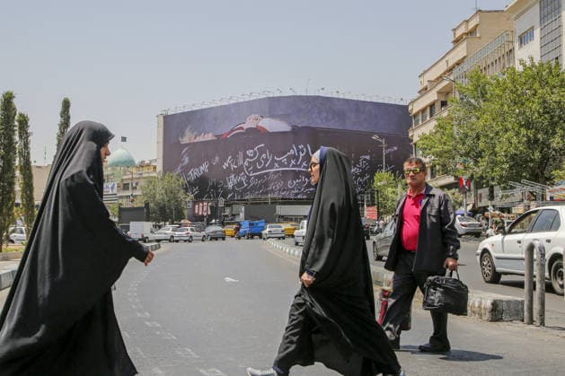 Giant billboard depicting Donald Trump hung in Tehran s Revolution Square TEHRAN, IRAN - JULY 15 : A view of a billboard depicting US President Donald Trump lying in a black coffin made of concrete barriers is hung at Enghelab (Revolution) Square with slogans written on the coffin walls , referring to the chalk-written barriers used at the ceremony for the late Iranian leader Ali Khamenei at the Imam Khomeini Musalla Mosque, on July 15, 2026 in Tehran, Iran. Fatemeh Bahrami Anadolu Tehran Iran. Editorial use only. Please get in touch for any other usage.  Copyright: x2026xAnadoluxFatemehxBahramix