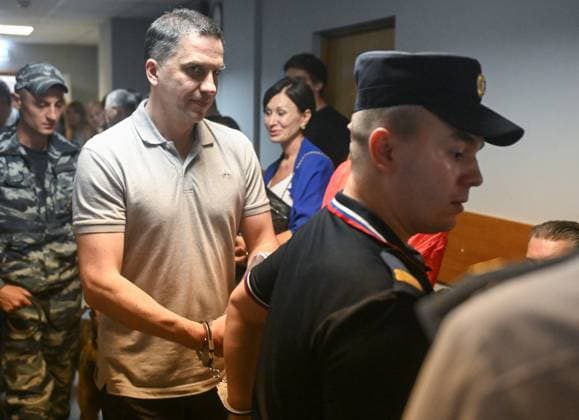 Russia Rusagro Founder Fraud Trial 9205860 15.07.2026 Former CEO of Russian agricultural giant Rusagro Group Maxim Basov, charged with large-scale fraud and organising abuse of office in connection with the corruption case against the company, is escorted by police before a hearing at the Zamoskvoretsky District Court in Moscow, Russia. Mikhail Voskresenskiy Sputnik Moscow Russia  Copyright: xMikhailxVoskresenskiyx
