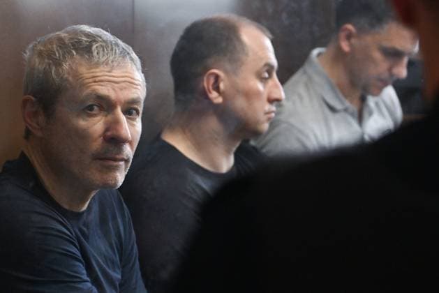 Russia Rusagro Founder Fraud Trial 9205870 15.07.2026 Founder of Russian agricultural giant Rusagro Group Vadim Moshkovich, former Tambov Region Governor Sergei Ivanov and former Rusagro Group CEO Maxim Basov, defendants in the Rusagro corruption case, are seen inside a defendant s glass cage during a hearing at the Zamoskvoretsky District Court in Moscow, Russia. Mikhail Voskresenskiy Sputnik Moscow Russia  Copyright: xMikhailxVoskresenskiyx