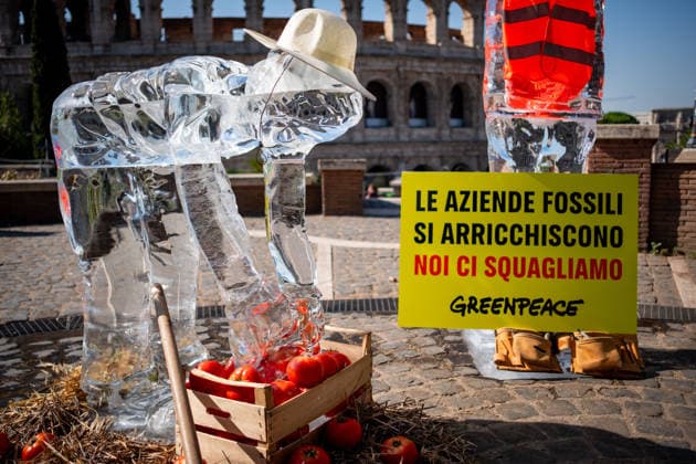 July 15, 2026, Rome, Rm, Italy: On the occasion of the European Day in remembrance of the victims of the global climate crisis, Greenpeace Italy activists let three ice statues melt in the sun near the Colosseum to denounce the impact of the climate crisis on workers. The statues depicted a farm worker, a construction worker, and a delivery driver, among the groups most exposed to heat waves. Fossil fuel corporations get rich, we melt reads the sign. Rome Italy - ZUMAg256 20260715_znp_g256_012 Copyright: xMarcoxDixGianvitox