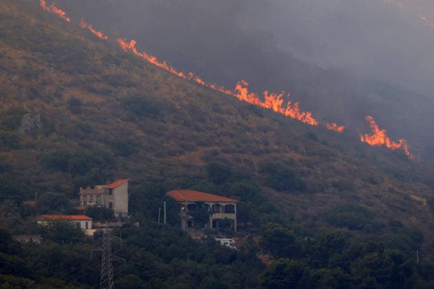 Italy battles extreme heat and wildfires PALERMO, ITALY - JULY 15: A view of a wildfire that broke out in the maquis vegetation on the slopes of Mount Longa near Palermo, Sicily, Italy, on July 15, 2026. The blaze spread rapidly due to strong winds as firefighters battled the fire with firefighting aircraft and helicopters in an effort to bring it under control. Alberto Lo Bianco Anadolu Palermo Italy. Editorial use only. Please get in touch for any other usage.  Copyright: x2026xAnadoluxAlbertoxLoxBiancox