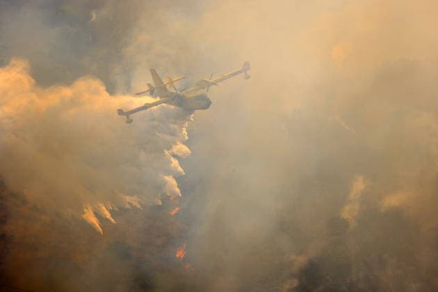 Italy battles extreme heat and wildfires PALERMO, ITALY - JULY 15: Firefighters battle the fire with firefighting aircraft and helicopters in an effort to bring it under control as a wildfire that broke out in the maquis vegetation on the slopes of Mount Longa spreading rapidly due to strong winds near Palermo, Sicily, Italy, on July 15, 2026. Alberto Lo Bianco Anadolu Palermo Italy. Editorial use only. Please get in touch for any other usage.  Copyright: x2026xAnadoluxAlbertoxLoxBiancox