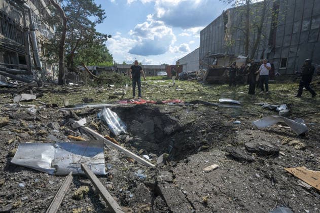 Russian guided bomb strike damages industrial zone in Kharkiv KHARKIV, UKRAINE - JULY 15: The aftermath of a strike by a Russian guided aerial bomb is seen in an industrial zone in Kharkiv, Ukraine, on July 15, 2026. The attack caused severe damage to industrial buildings housing woodworking, footwear and clothing manufacturing facilities, as well as other civilian enterprises. Seven vehicles parked near the impact site were also damaged. According to local authorities, eight civilians were injured in the strike. Men aged 44, 49, 50 and 57, along with women aged 31, 51 and 60, were hospitalized with injuries of varying severity. A 51-year-old man who suffered cuts from shattered glass received medical treatment at the scene. Serhii Masin  Copyright: x2026xAnadoluxSerhiixMasinx