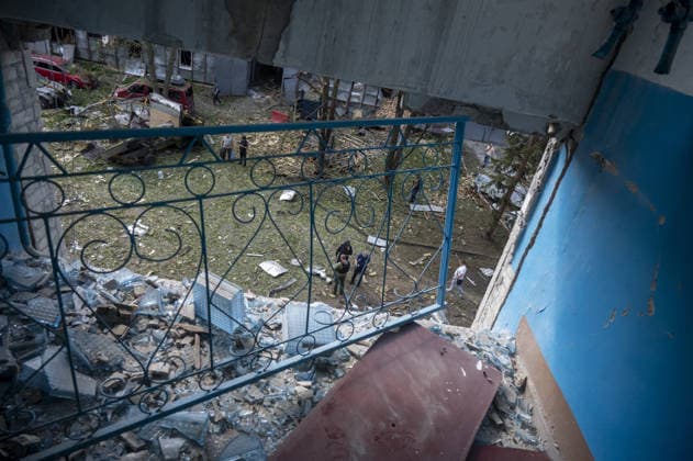 Russian guided bomb strike damages industrial zone in Kharkiv KHARKIV, UKRAINE - JULY 15: The aftermath of a strike by a Russian guided aerial bomb is seen in an industrial zone in Kharkiv, Ukraine, on July 15, 2026. The attack caused severe damage to industrial buildings housing woodworking, footwear and clothing manufacturing facilities, as well as other civilian enterprises. Seven vehicles parked near the impact site were also damaged. According to local authorities, eight civilians were injured in the strike. Men aged 44, 49, 50 and 57, along with women aged 31, 51 and 60, were hospitalized with injuries of varying severity. A 51-year-old man who suffered cuts from shattered glass received medical treatment at the scene. Serhii Masin  Copyright: x2026xAnadoluxSerhiixMasinx