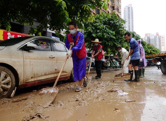 GUIGANG, CHINA - JULY 15: Residents clear silt and debris after floodwater recedes on July 15, 2026 in Guigang, Guangxi Zhuang Autonomous Region of China. Recent extreme rainstorms triggered by Typhoon Maysak, the 10th typhoon of the year, have caused severe flooding in parts of Guangxi in the Pearl River basin.  Copyright: xVCGx 111654558948