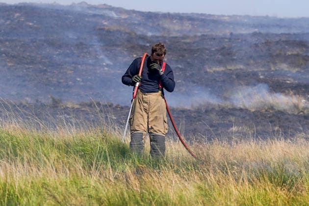 July 16, 2026, Glossop, Derbyshire, UK: Glossop, UK. Firefighters tackle a massive moorland wildfire on Tintwistle Moor in Glossop, Derbyshire. Glossop UK  - ZUMAl94_ 20260716_zaf_l94_010 Copyright: xIoannisxAlexopoulosx