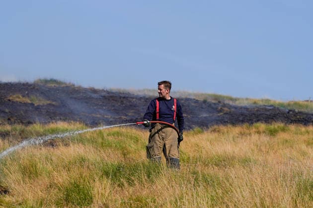 July 16, 2026, Glossop, Derbyshire, UK: Glossop, UK. Firefighters tackle a massive moorland wildfire on Tintwistle Moor in Glossop, Derbyshire. Glossop UK  - ZUMAl94_ 20260716_zaf_l94_005 Copyright: xIoannisxAlexopoulosx