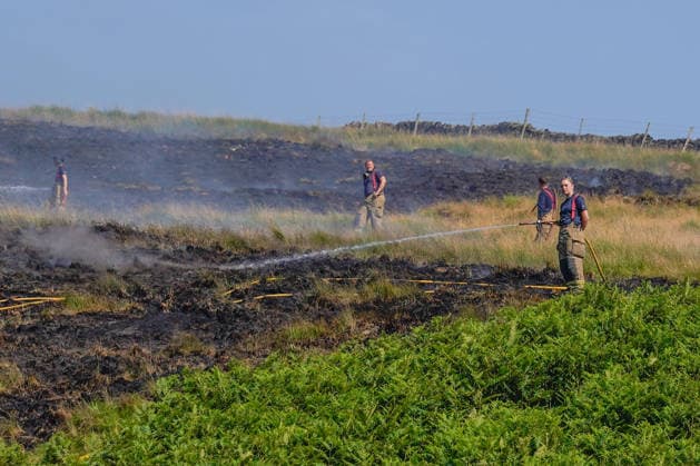 July 16, 2026, Glossop, Derbyshire, UK: Glossop, UK. Firefighters tackle a massive moorland wildfire on Tintwistle Moor in Glossop, Derbyshire. Glossop UK  - ZUMAl94_ 20260716_zaf_l94_012 Copyright: xIoannisxAlexopoulosx