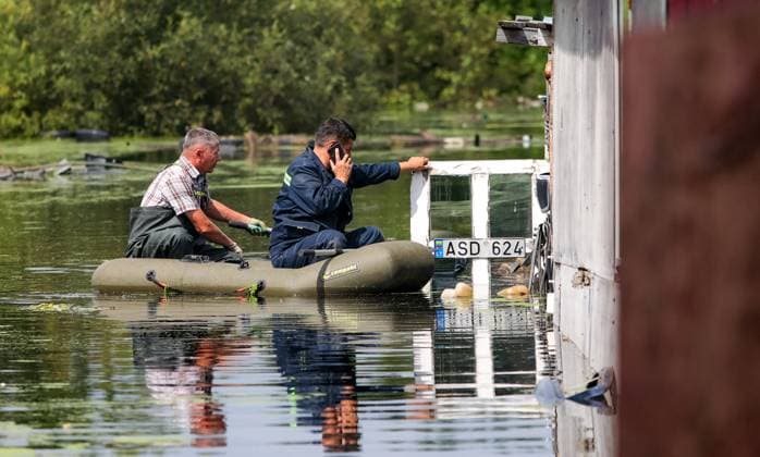 Russia Floods 9206484 16.07.2026 Men in an inflatable boat row along a flooded road after heavy rains caused rivers to rise in the Irbitsky District of Sverdlovsk Region, Russia. Irina Semenova Sputnik Sverdlovsk Oblast Region Russia  Copyright: xIrinaxSemenovax