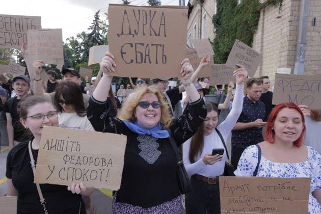 Anti-War Protesters Gather - Kharkiv Approximately 500 young people gathered at Freedom Square in Kharkiv on July 16, 2026, to protest against the dismissal of Education Minister Mykhailo Fedorov. Demonstrators held handmade cardboard signs with messages in Ukrainian, including calls to keep the minister in office. The protest reflects student and youth concerns over education policy changes in Ukraine. Photo by Titov Yevhen ABACAPRESS.COM Kharkiv Kharkiv Oblast Ukraine  Copyright: xTitovxYevhen ABACAx