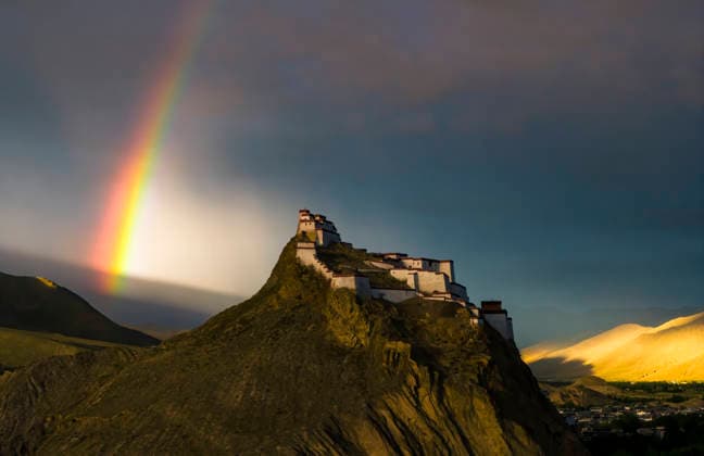 SHIGATSE CHINA - JULY 16: Double rainbow hangs in the sky above Jiangzi Zongshan Castle on July 16, 2026 in Jiangzi, Xizang Autonomous Region of China.  Copyright: xVCGx 111654720368