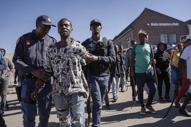 Anti-migrant group holds protest in Johannesburg JOHANNESBURG, SOUTH AFRICA - JULY 16: An anti-migrant group of dozens of people hold a protest in the Alexandra township of Johannesburg, South Africa on July 16, 2026. While some of the demonstrators carried sticks, security forces took precautions along the march route as brief tensions erupted between officers and some of the protesters. Ihsaan Haffejee Anadolu Johannesburg South Africa. Editorial use only. Please get in touch for any other usage.  Copyright: x2026xAnadoluxIhsaanxHaffejeex