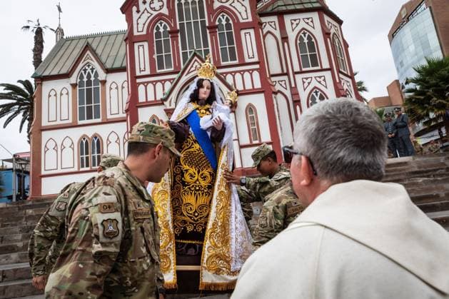 July 16, 2026, Arica, Chile: ARICA, CHILE Ã¢â‚¬ JULY 2026: Chilean soldiers carry an image of the Virgen del Carmen from the foot of the steps into San Marcos Cathedral, where it will remain for worshippers to venerate over the following days, while a Catholic priest looks on. This year marks 100 years since the Church crowned the Virgen del Carmen, Patroness of Chile. Ibar Silva JNA Press. Arica Chile - ZUMAq101 20260716_zna_q101_061 Copyright: xIbarxFelipexSilvaxCanalesx