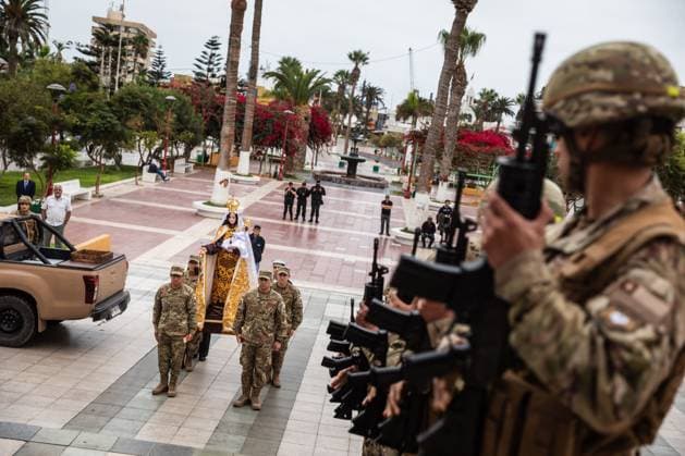 July 16, 2026, Arica, Chile: ARICA, CHILE Ã¢â‚¬ JULY 2026: Chilean soldiers carry an image of the Virgen del Carmen from the foot of the steps into San Marcos Cathedral, where it will remain for worshippers to venerate over the following days, while a Catholic priest looks on. This year marks 100 years since the Church crowned the Virgen del Carmen, Patroness of Chile. Ibar Silva JNA Press. Arica Chile  - ZUMAq101 20260716_zna_q101_058 Copyright: xIbarxFelipexSilvaxCanalesx