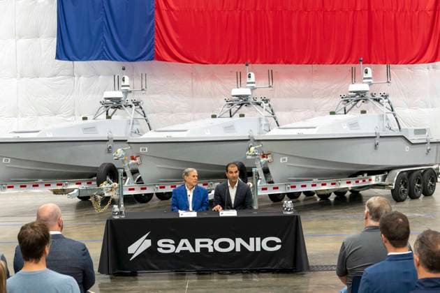 July 16, 2026, Austin, Tx, USA: Texas Governor GREG ABBOTT announces with Saronic CEO DINO MAVROOKAS the expansion to south Texas of the ship and drone boat manufacturer Saronic to a 1,000 acre site at the Port of Brownsville. The Saronic Corsair in the background were the type of drones used to rescue downed U.S. pilots in the Gulf of Oman and attack naval facilities in Iraq. Austin USA  - ZUMAd150 20260716_znp_d150_006 Copyright: xBobxDaemmrichx