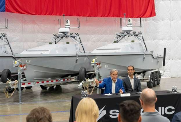 July 16, 2026, Austin, Tx, USA: Texas Governor GREG ABBOTT announces with Saronic CEO DINO MAVROOKAS the expansion to south Texas of the ship and drone boat manufacturer Saronic to a 1,000 acre site at the Port of Brownsville. The Saronic Corsair in the background were the type of drones used to rescue downed U.S. pilots in the Gulf of Oman and attack naval facilities in Iraq. Austin USA - ZUMAd150 20260716_znp_d150_015 Copyright: xBobxDaemmrichx