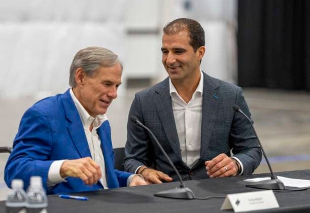 July 16, 2026, Austin, Tx, USA: Texas Governor GREG ABBOTT, l, talks with Saronic CEO DINO MAVROOKAS the expansion to south Texas of the ship and drone boat manufacturer Saronic to a 1,000 acre site at the Port of Brownsville. The Saronic Corsair in the background were the type of drones used to rescue downed U.S. pilots in the Gulf of Oman and attack naval facilities in Iraq. Austin USA - ZUMAd150 20260716_znp_d150_017 Copyright: xBobxDaemmrichx