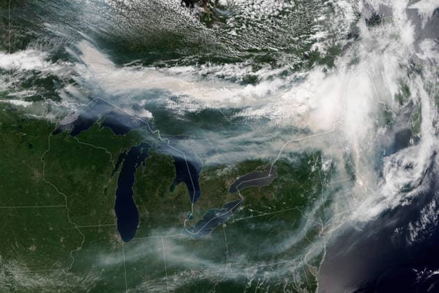July 14, 2026, Toronto, Ont, Canada: Satellite image showing smoke from multiple wildland fires pours eastward over Canada and the United States, July 14, 2026, from Earth Orbit. At least 830 wildfires were burning in Canada, along with more than a dozen in northern Minnesota, forcing mandatory evacuations and spreading unhealthy smoke down to the Lower 48. Toronto Canada - ZUMAp138 20260714_zaa_p138_033 Copyright: xLaurenxDauphin NasaxGsfcx