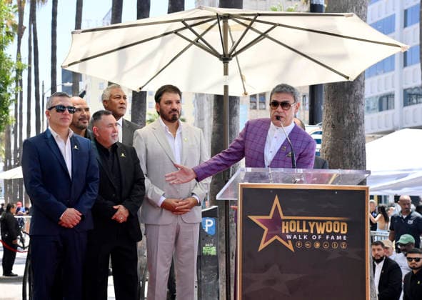 Ricardo Munoz of the band Intocable addresses the audience during an unveiling ceremony honoring the band with the 2,852nd star on the Hollywood Walk of Fame in Los Angeles on Thursday, July 16, 2026.  LAP2026071601 JIMxRUYMEN