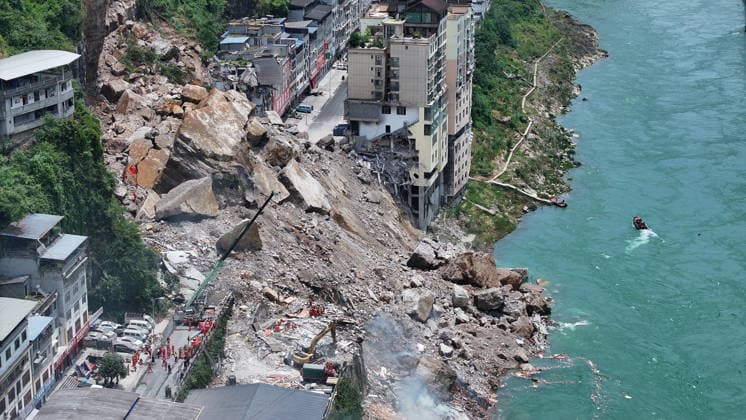 (260717) -- CHONGQING, July 17, 2026 -- An aerial drone photo taken on July 17, 2026 shows the site of a rainfall-induced landslide along a section of the Wujiang River in southwest China s Chongqing Municipality. Nine people have so far been rescued after a rainfall-induced landslide occurred along a section of the Wujiang River in southwest China s Chongqing Municipality on Friday. None of those rescued sustained life-threatening injuries, according to local authorities of Pengshui Miao and Tujia Autonomous County in Chongqing. The geological disaster saw massive amounts of rock and soil wash downslope at 9:08 a.m. Friday, burying more than 10 residential buildings, leaving local residents trapped and unaccounted for. ) (SpotNews) 