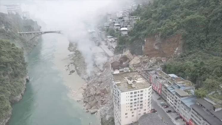 RECORD DATE NOT STATED 270765.jpg Drone image of a massive landslide caused multiple buildings to collapse near the Wujiang Three Bridges in Pengshui, Chongqing, China, on Friday July 17, 2026. State media says a landslide in the southwestern Chinese city of Chongqing has buried some residential buildings, trapping an undetermined number of people. A landslide Friday in the southwestern Chinese city of Chongqing buried some residential buildings, trapping an undetermined number of people, state media reported. State broadcaster CCTV said at least eight people were rescued from the debris, and that search and rescue operations were ongoing. CCTV said the landslide occurred at around 9:08 a.m. in Chongqing EDITORIAL USE ONLY  Copyright: xx 270765 x eyepress127280