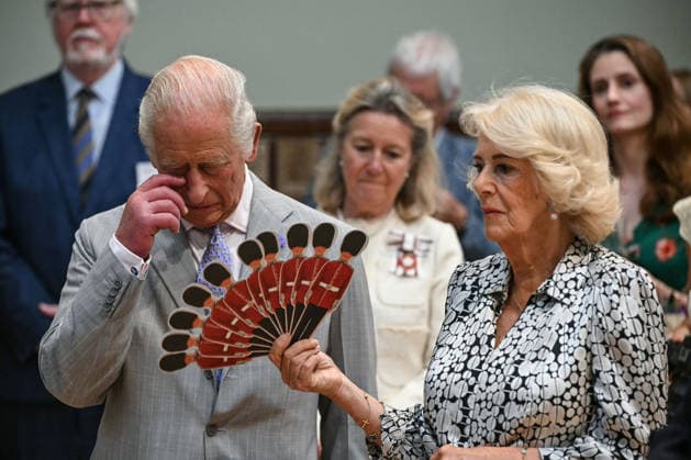 Charles and Camilla visit Blandford Forum Britain s Queen Camilla (R) fans Britain s King Charles III (L) as they listen to a performance of Dorset Opera, during a visit to the Main Hall at the Blandford Forum Town Hall and Corn Exchange in Blandford Forum, Dorset, south-west England on July 16, 2026., Credit:JUSTIN TALLIS PA ROTA - B68 Avalon United Kingdom, Dorset, Blandford Forum  Copyright: xJUSTINxTALLISx xPAxROTAx-xB68x xAvalonx 1117025668