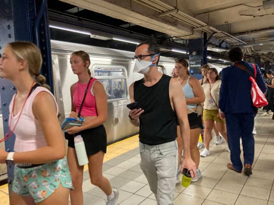 Subway ridership in New York Subway riders, one with a mask in New York on Thursday, July 16, 2026. New York has an air quality alert because of smoke drifting down from Canadian wildfires. (  RichardxB.xLevine