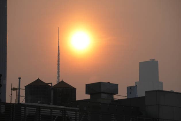 July 18, 2026, New York, New York, USA: The sun rises through the smoke from Canadian Wildfires over Manhattan on July 18, 2026 in New York. More than 200 wildfires are burning in Canada causing smoke to drift across the United States spiking the air quality index. New York USA - ZUMAb148 20260718_zap_b148_008 Copyright: xBryanxSmithx